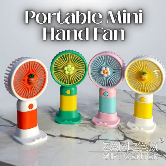 Four colorful portable mini hand fans on a marble surface with 'Zam Zam Gift Center' branding.